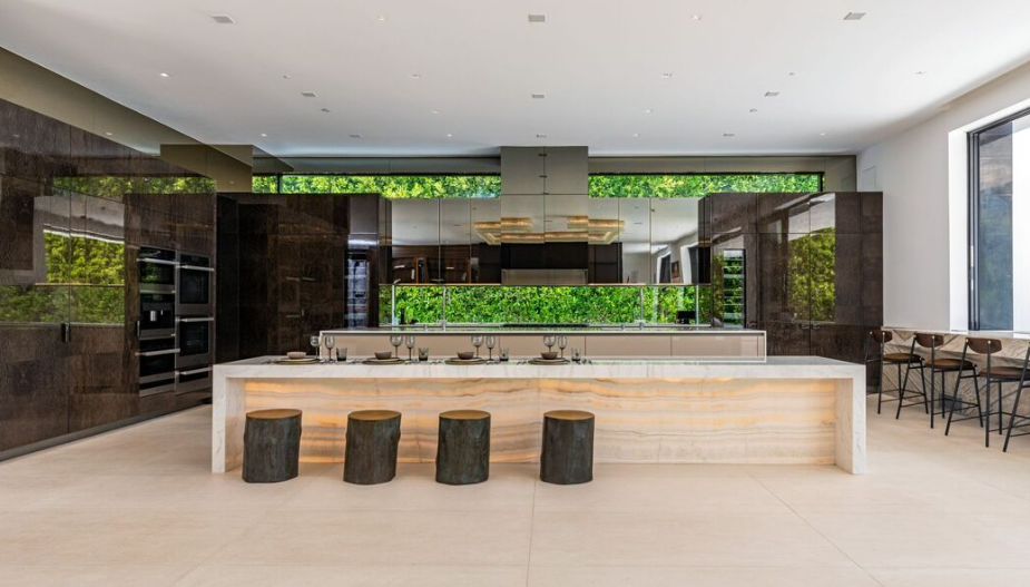 CAD Stone Works backlit translucent onyx kitchen island counter and custom natural stone surfaces at Beverly Hills Flats Residence.