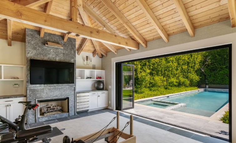 Floor to ceiling Bardiglio fireplace surround with mitered edges at the Canon Drive Residence cabana in Beverly Hills, fabricated and installed by CAD Stone Works