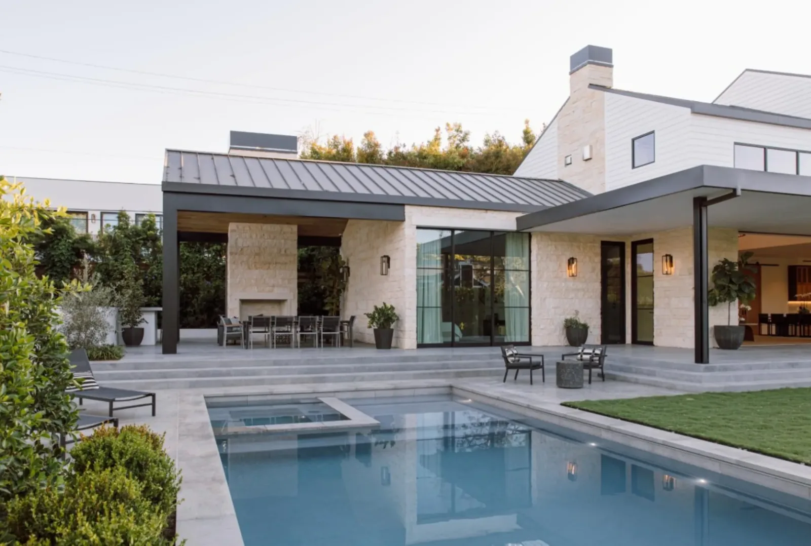 Lombard Estate exterior limestone patio and pool in Pacific Palisades, fabricated and installed by CAD Stone Works